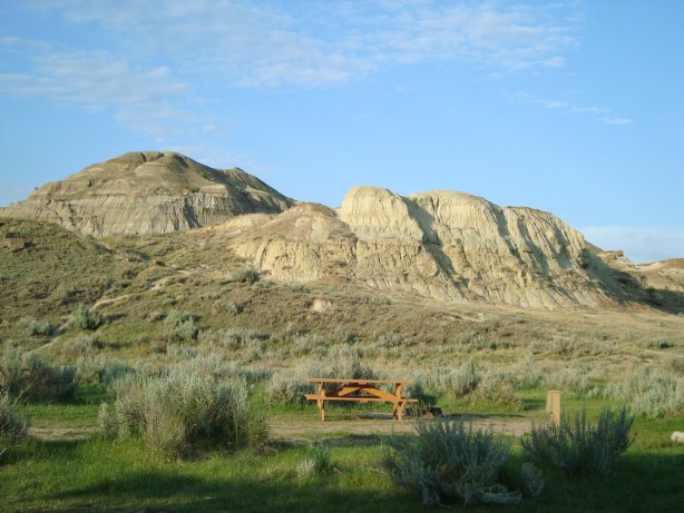 Badlands hills border the campground
